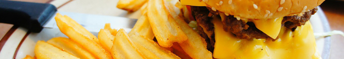 Eating Burger at Wesley's Burger Shoppe restaurant in Woodford, VA.